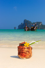 Image showing Coconut cocktail on the beach