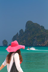 Image showing Young woman walking on the beach 