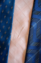Image showing cravat tie scarfs texture blue pink background 