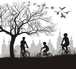 Image showing Family on bicycle trip out of town