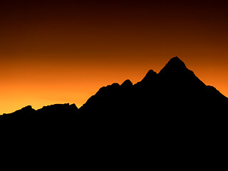 Image showing Mountain peaks of Skottind in Polar night - sunset