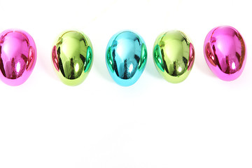 Image showing Line of vibrant shiny Easter Eggs