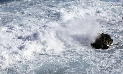 Image showing ocean waves crashing on rocks