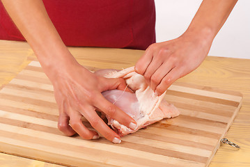 Image showing Removing chicken skin