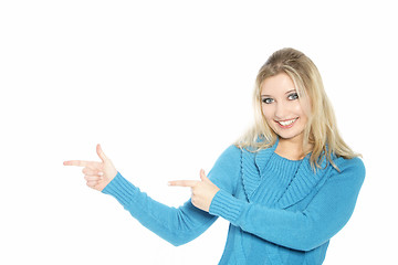 Image showing Woman pointing with both hands