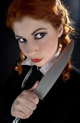 Image showing crazy schoolgirl with knife