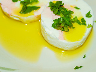 Image showing Tomino cheese with rucola and olive oil