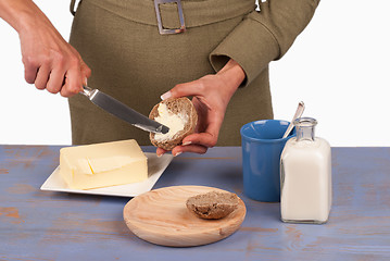 Image showing Spreading butter