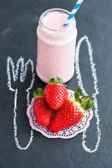 Image showing Fresh whole strawberries and smoothie