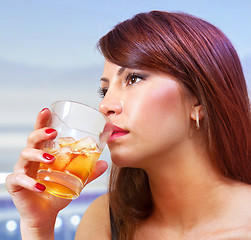 Image showing woman with glass of whisky
