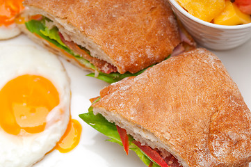 Image showing ciabatta panini sandwich eggs tomato lettuce