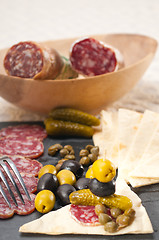 Image showing cold cut platter with pita bread and pickles