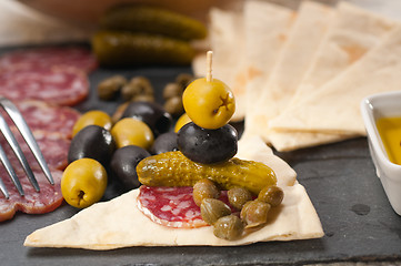 Image showing cold cut platter with pita bread and pickles