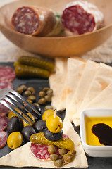 Image showing cold cut platter with pita bread and pickles