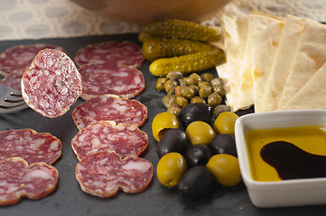 Image showing cold cut platter with pita bread and pickles