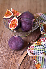 Image showing fresh figs, old knife and chequered towel