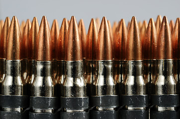 Image showing chain of bullets over white, horizontal