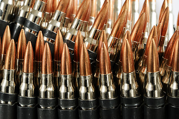 Image showing chain of bullets over white, close-up