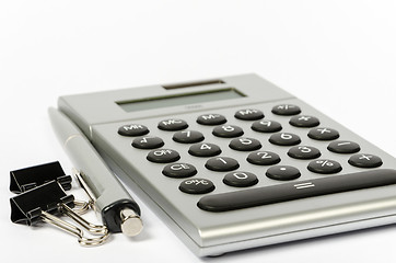 Image showing A calculator and a pen on a white background