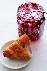 Image showing croissant and  pot of jam 