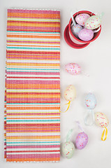 Image showing Striped napkin and easter eggs