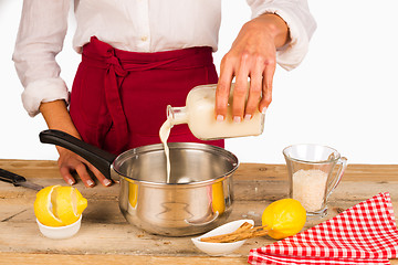 Image showing Pouring milk