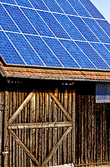 Image showing Solar panel on old barn