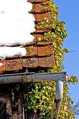 Image showing Old roof with snow