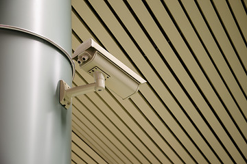 Image showing An overhead security camera at a subway station