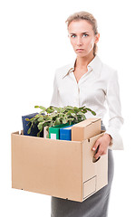 Image showing Portrait of business woman holding a box with her belongings