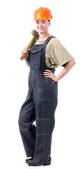 Image showing manual worker in overalls with a hammer