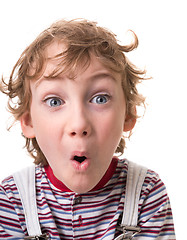 Image showing curly-haired boy surprised