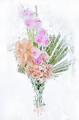 Image showing delicate bouquet of flowers in the ice