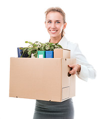 Image showing Portrait of business woman holding a box with her belongings