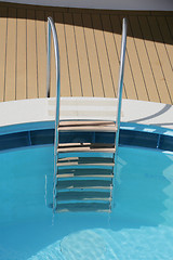 Image showing Pool ladder and swimming pool 