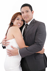 Image showing Loving couple smiling to camera over white background