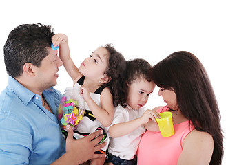 Image showing portrait of a nice family playing on white 