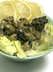 Image showing smoked oyster salad  lemon slices lettuce