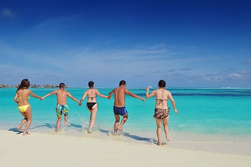 Image showing group of happy young people have fun on bach