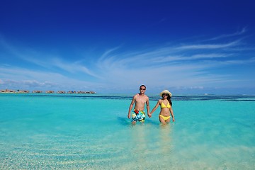 Image showing happy young  couple enjoying summer on beach