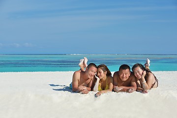 Image showing group of happy young people have fun on bach