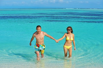 Image showing happy young  couple enjoying summer on beach