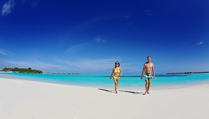 Image showing happy young  couple enjoying summer on beach