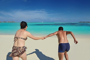 Image showing happy young  couple enjoying summer on beach