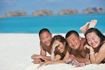 Image showing group of happy young people have fun on bach