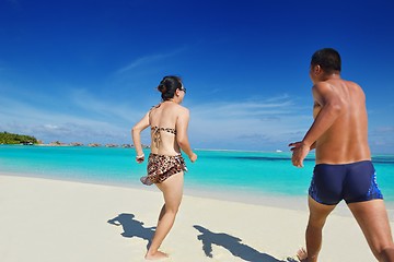 Image showing happy young  couple enjoying summer on beach