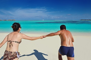 Image showing happy young  couple enjoying summer on beach