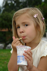 Image showing the girl eats ice-cream