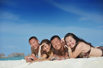 Image showing group of happy young people have fun on bach