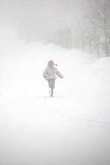 Image showing little girl in snowstorm